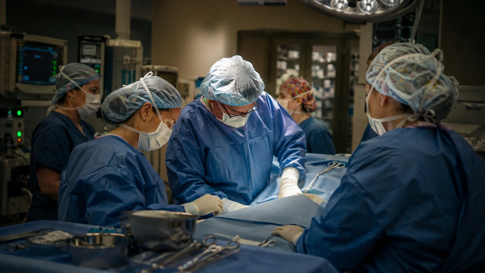 OB/GYN surgical team performing a procedure in an operating room