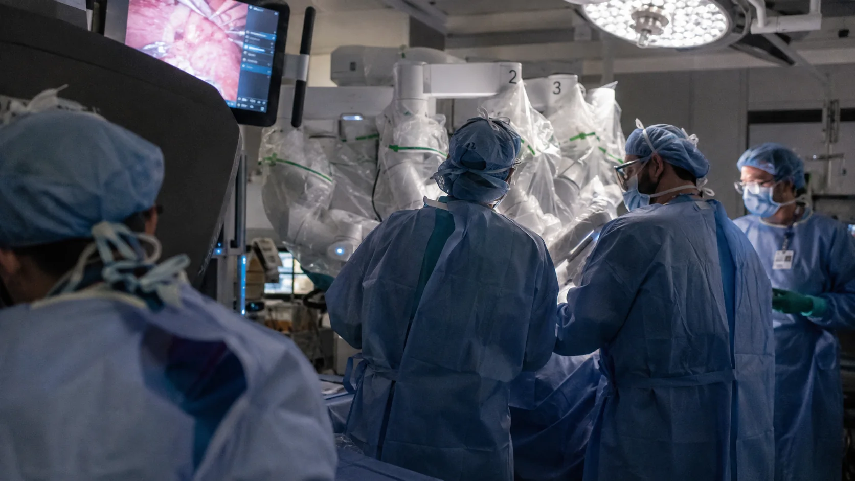 Surgical team working with a robotic surgery system in an operating room